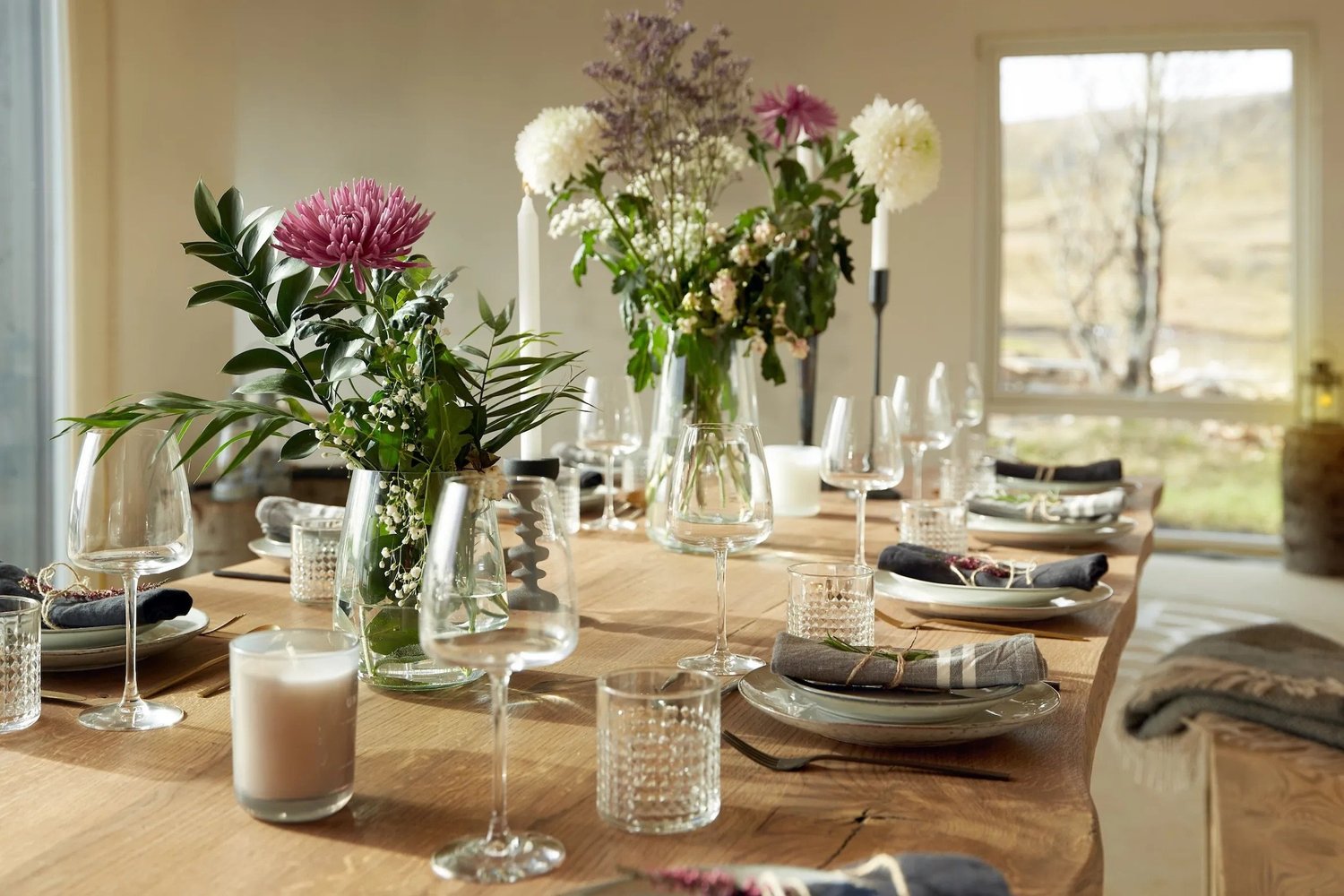 The dining table set with flowers and candles