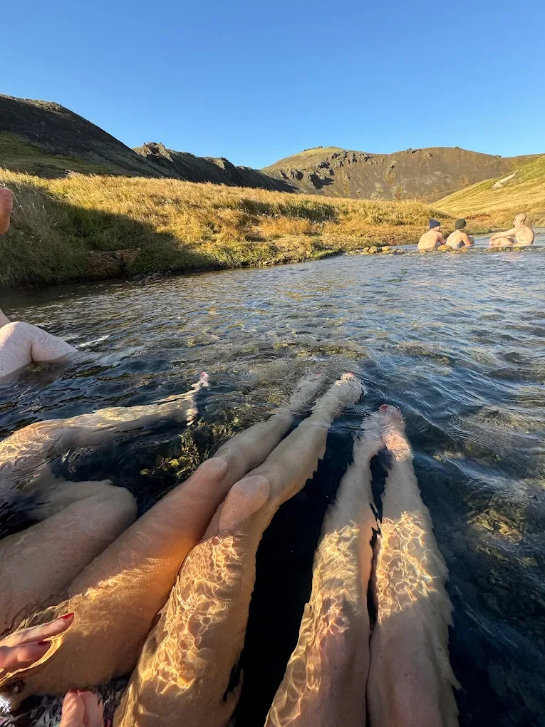 Relaxing in a geothermal hot spring among the mountains