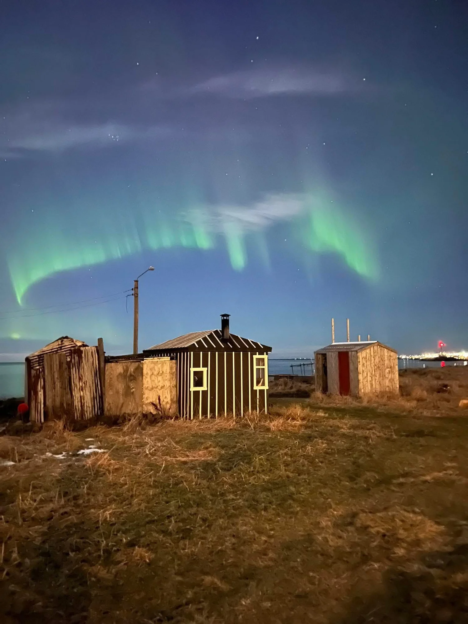 Northern lights over cabins