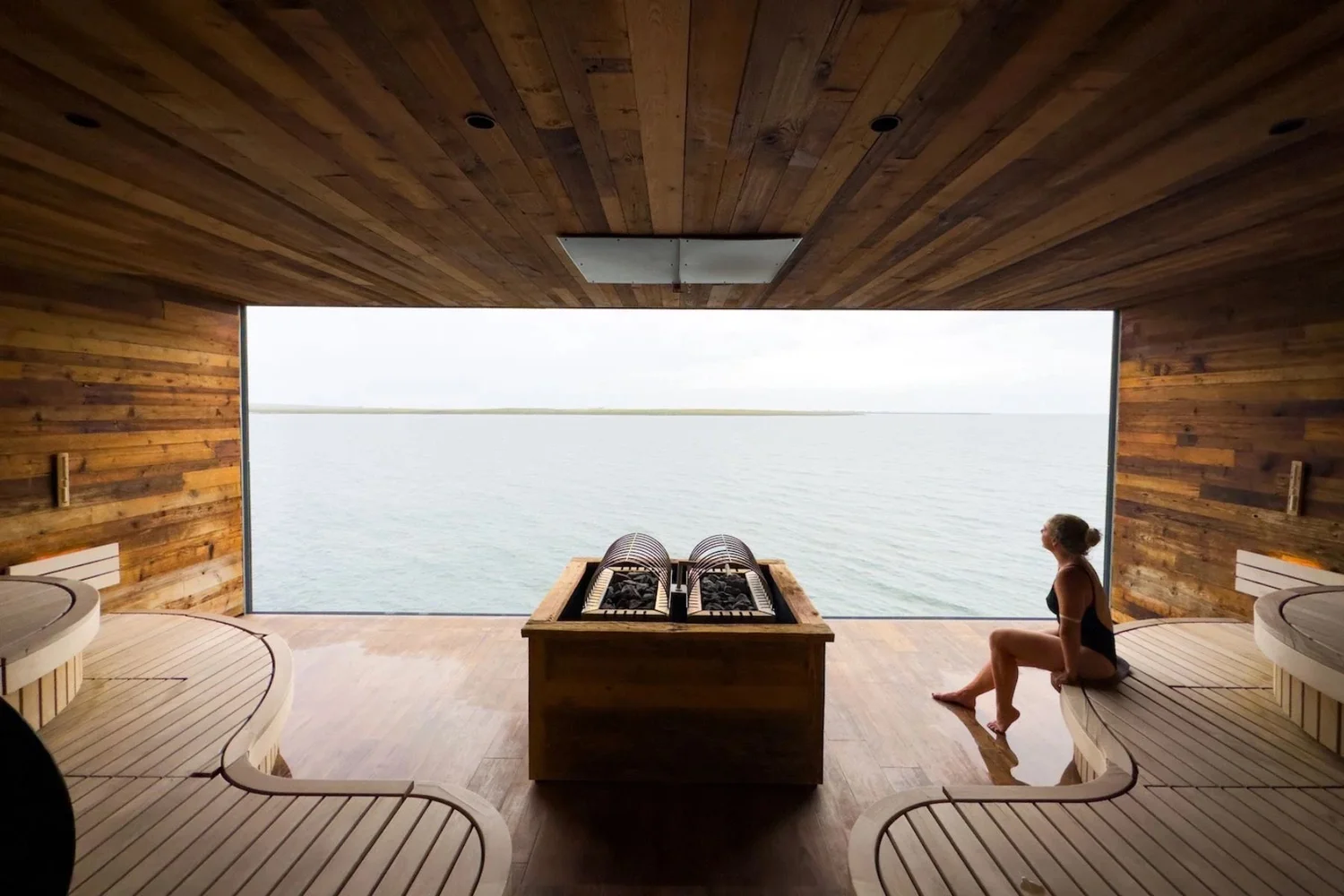 A sauna with a view of the water